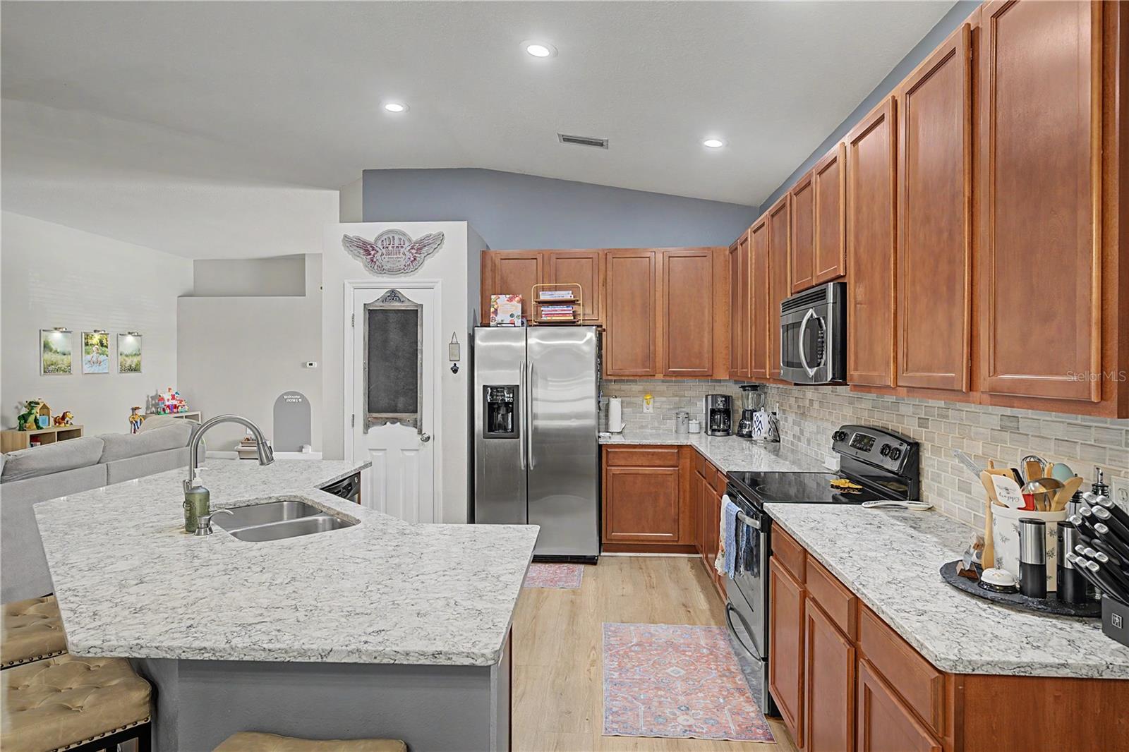 Stainless appliances and wood cabinets