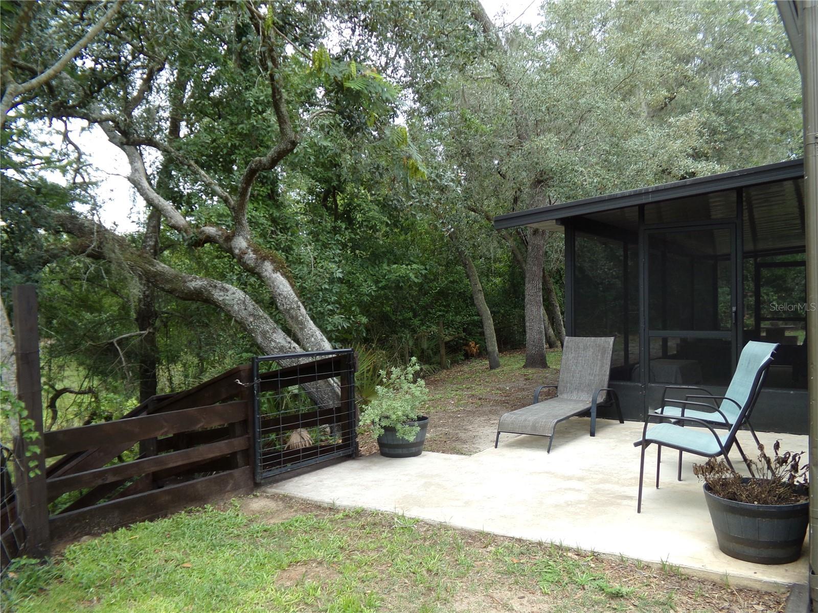 Second Patio Area with Steps to Riverbank