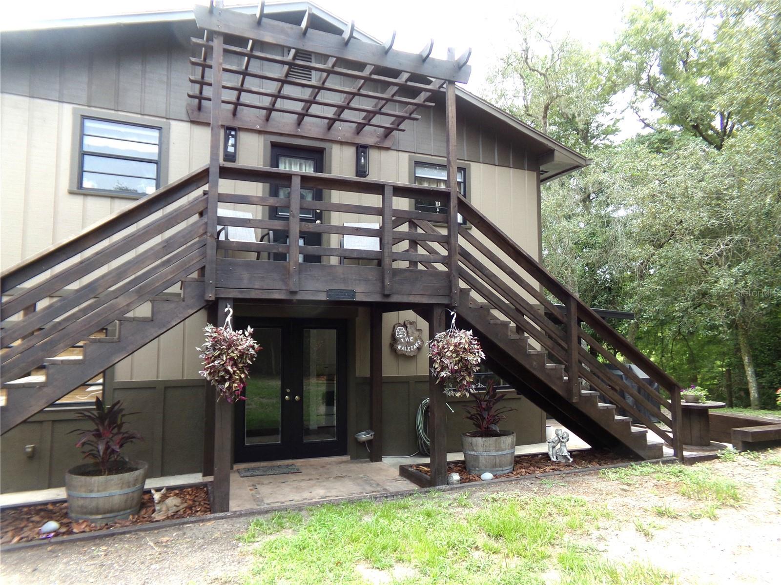 Front of House with Entrances to First and Second Floor