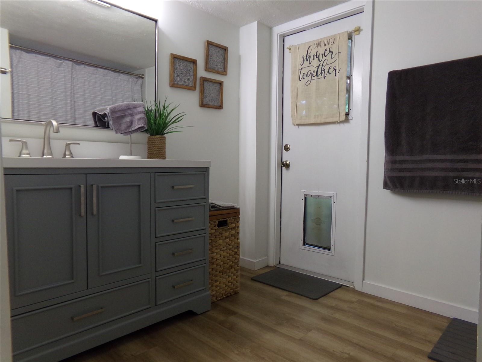 First Floor Bathroom Vanity with Door to Screened Patio