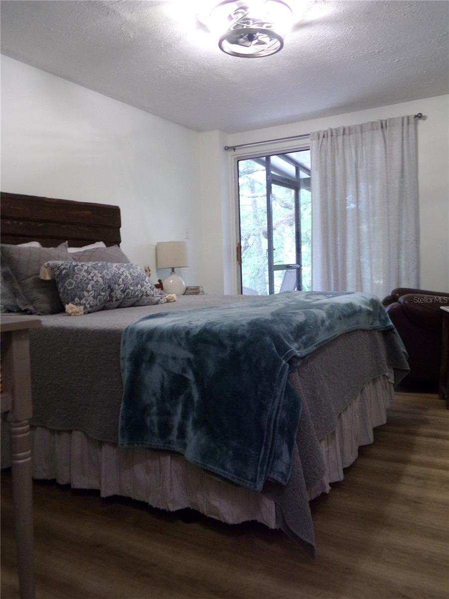 First Floor Bedroom 2 with Sliding Doors to Screened Porch