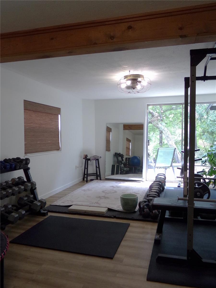 First Floor Livingroom with Sliding Doors to Second Patio and Steps to River