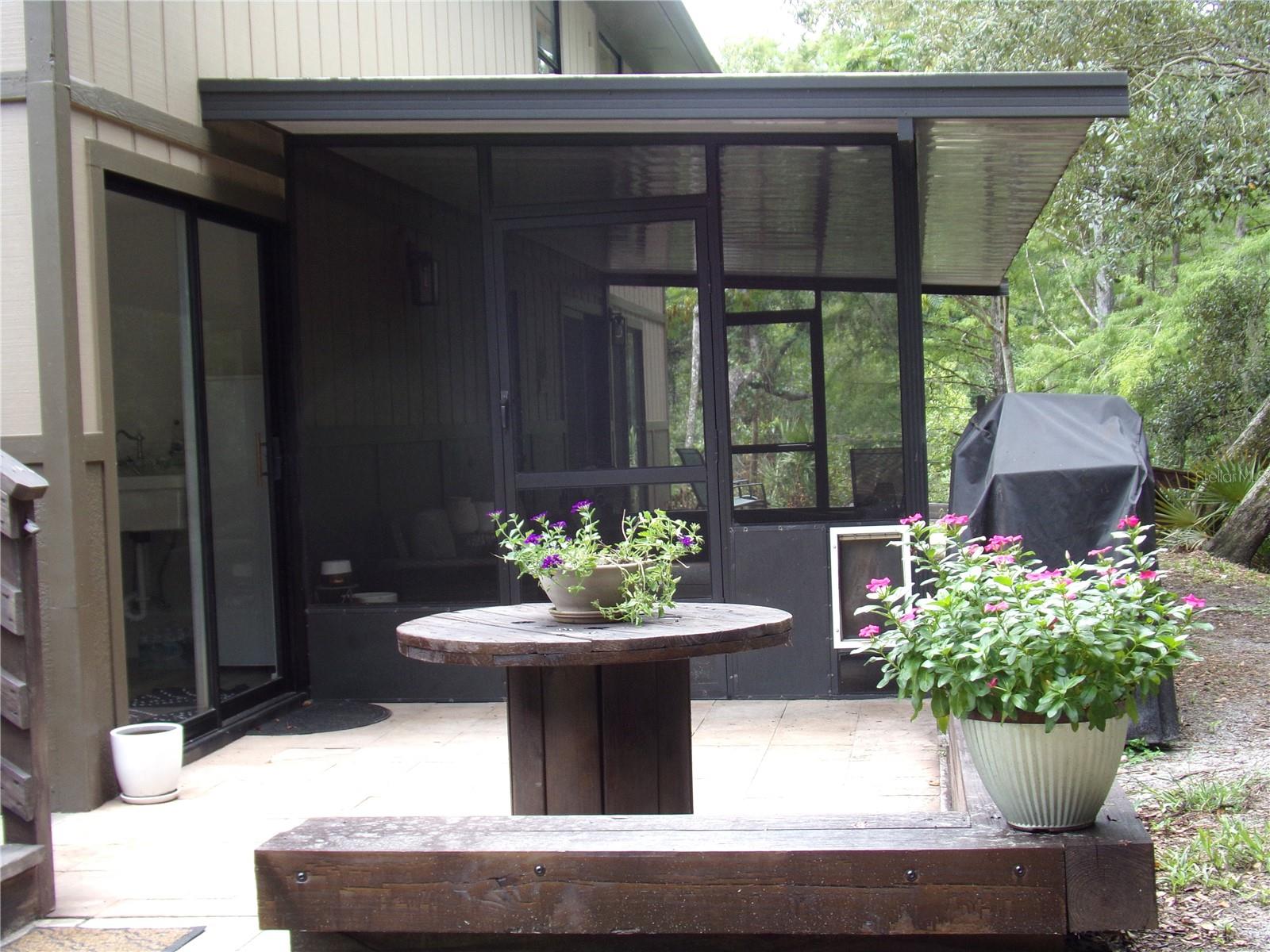 Paved Patio Area and Screened Porch