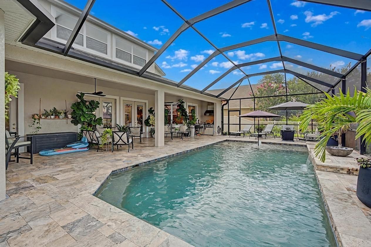 Refreshing pool with pond views and water feature!