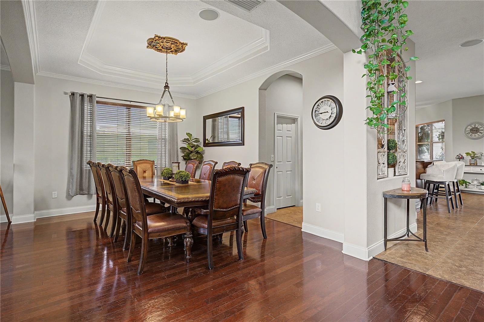 Wood floors in formal areas and Dining room with tray ceiling