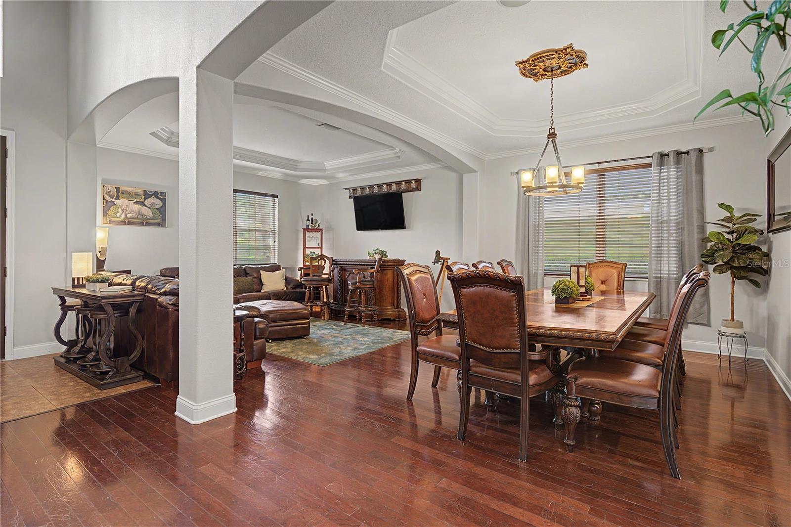 Arched Formal Living and Dining rooms with wood floors
