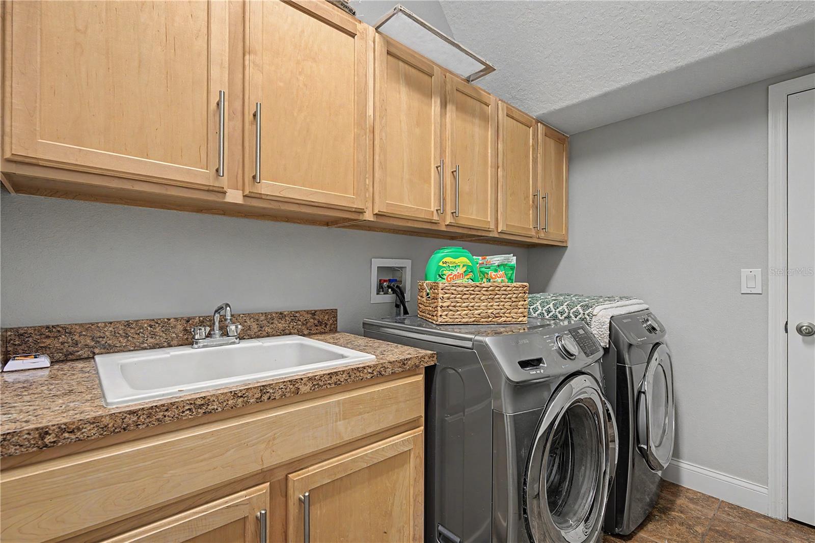 Storage above gas HE washer and dryer