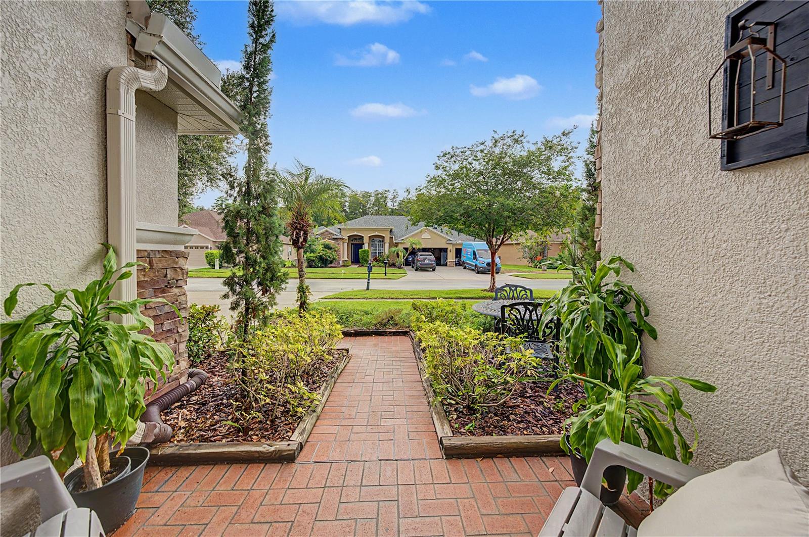 Paver walkway and entry with lush landscaping!
