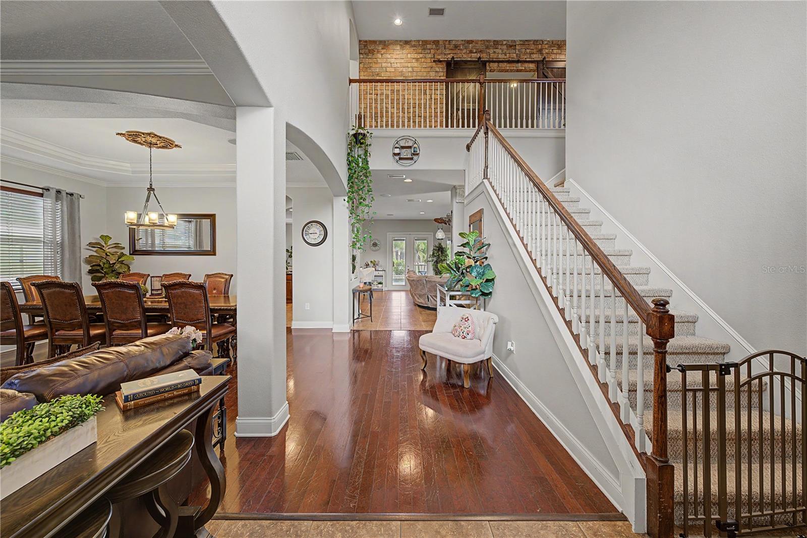 Stunning Staircase with Brick focal accent wall!