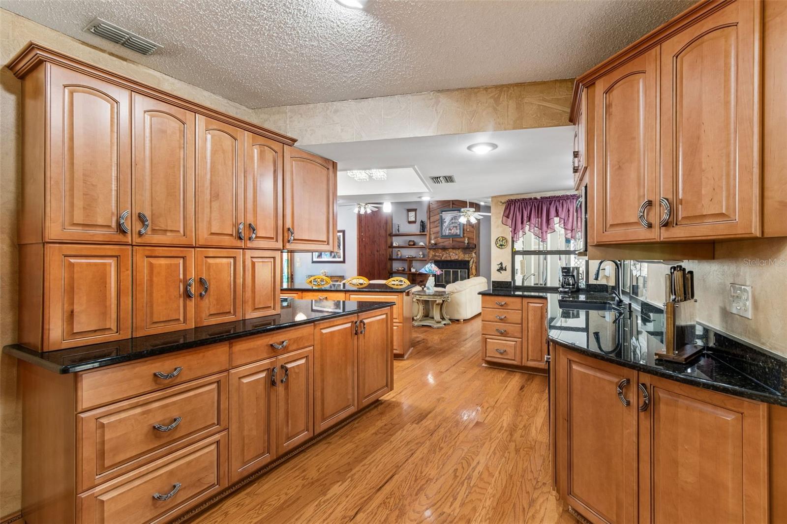 The wraparound kitchen provides another bank of cabinets and prep space