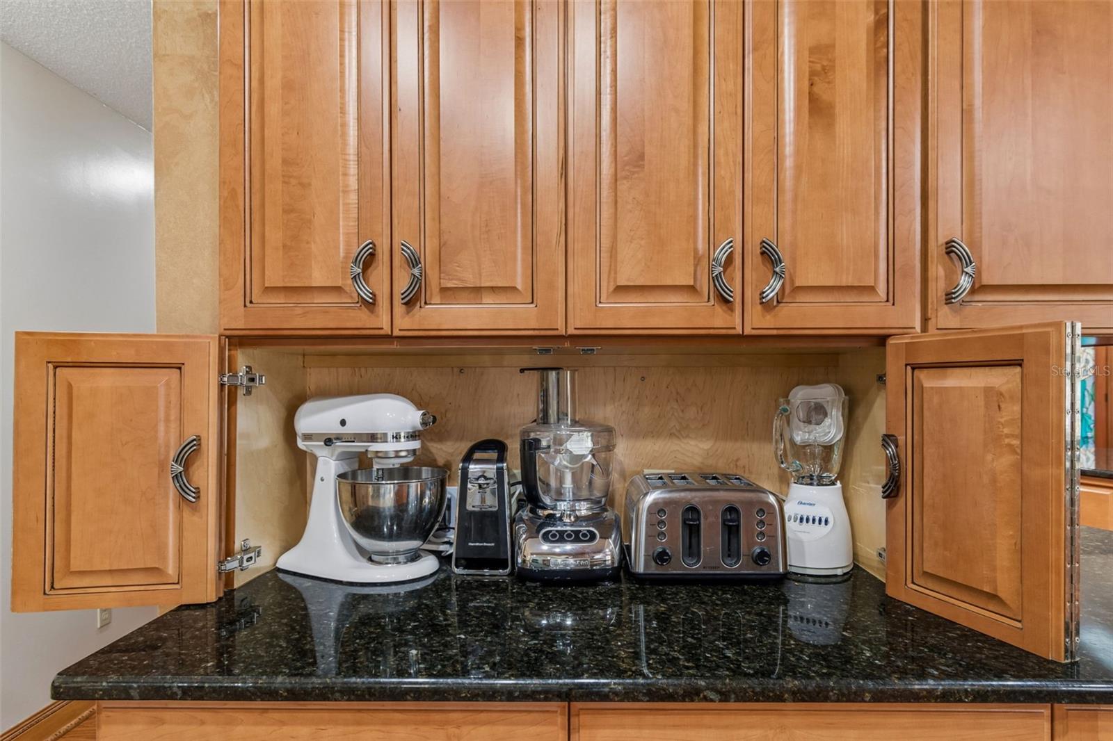 An appliance garage keeps your frequently used equipment handy while preserving counter/prep space!