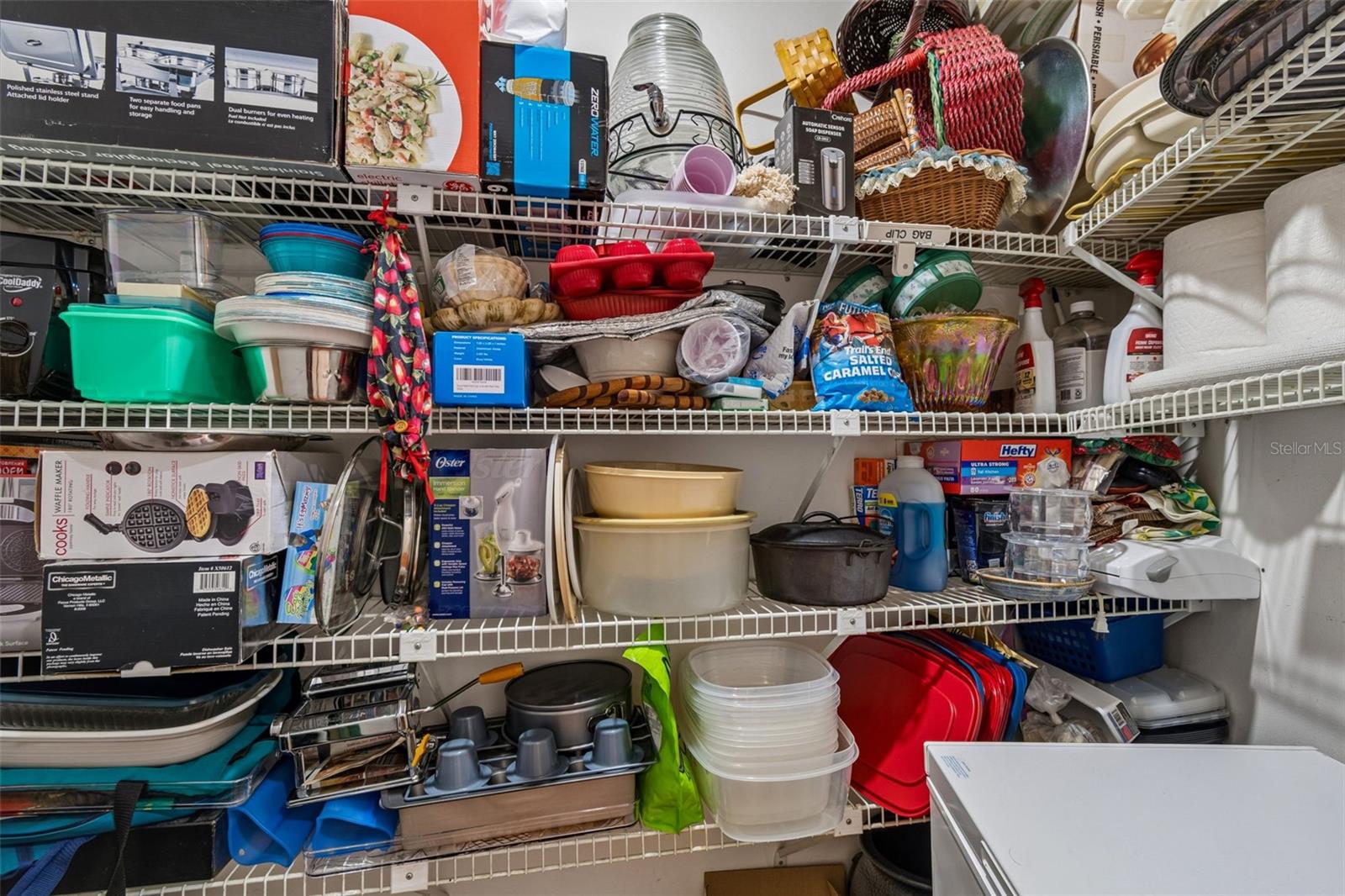 Secondary kitchen storage with enough room for a deep freezer, large kitchen appliances, etc.