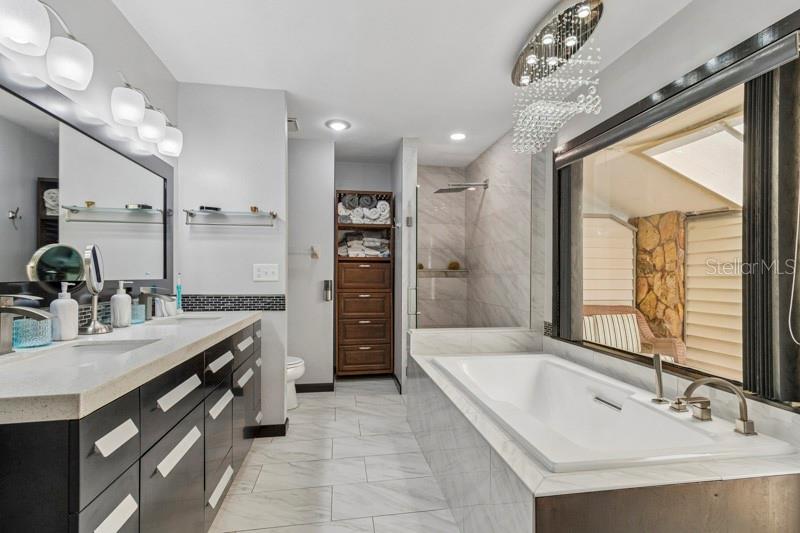Primary Ensuite 1 bathroom with modern updates and elegant lighting