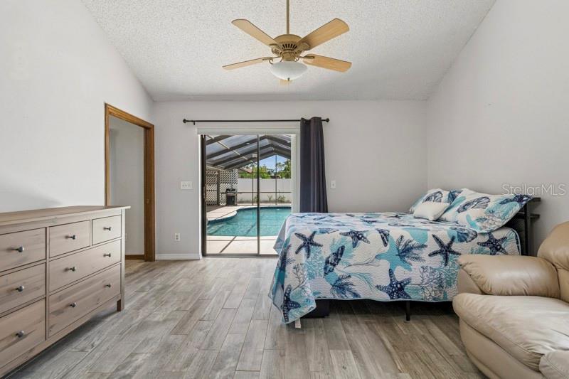 Primary Suite 2 contains a private entrance to the backyard oasis and a dedicated thermostat for the secondary AC unit