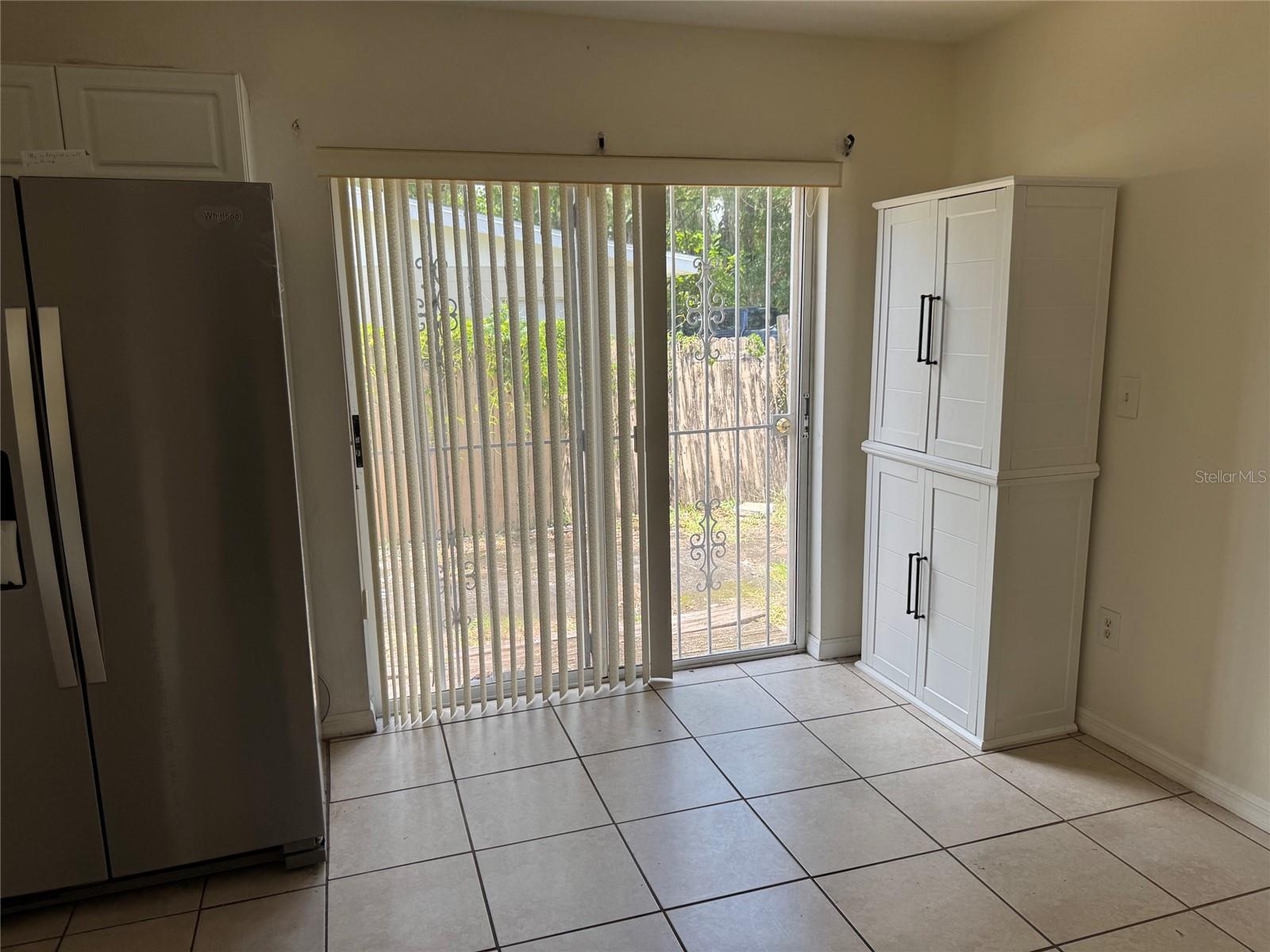 Eat in kitchen with sliding glass door to backyard
