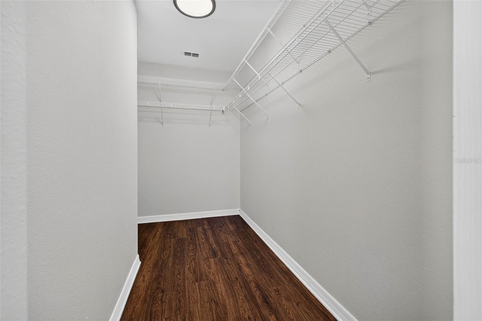 Downstairs Primary Suite Walk In Closet