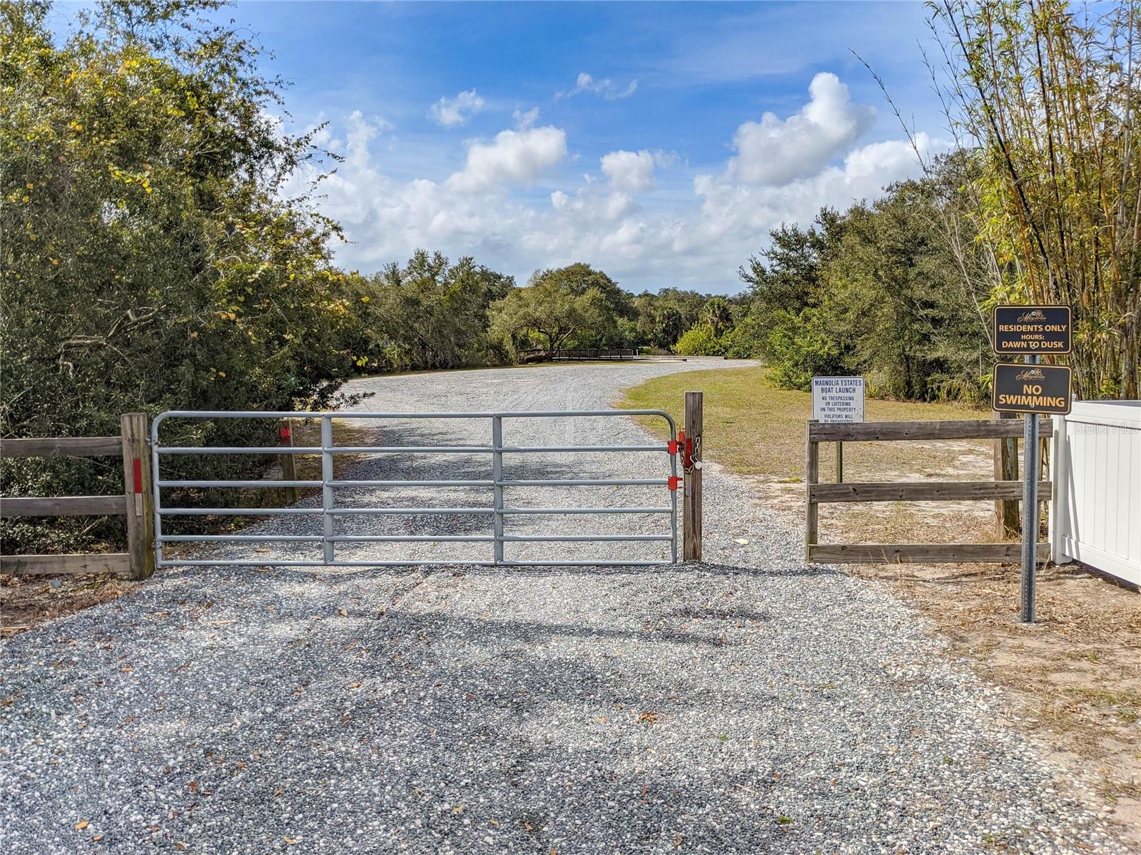 gated entrance to residents only community boat ramp