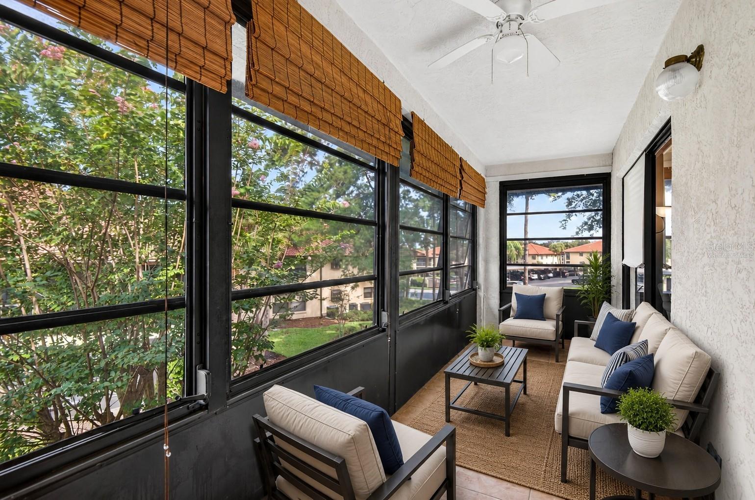 This photo is virtually staged. Balcony with sliding glass doors, runs the entire width of the condo.