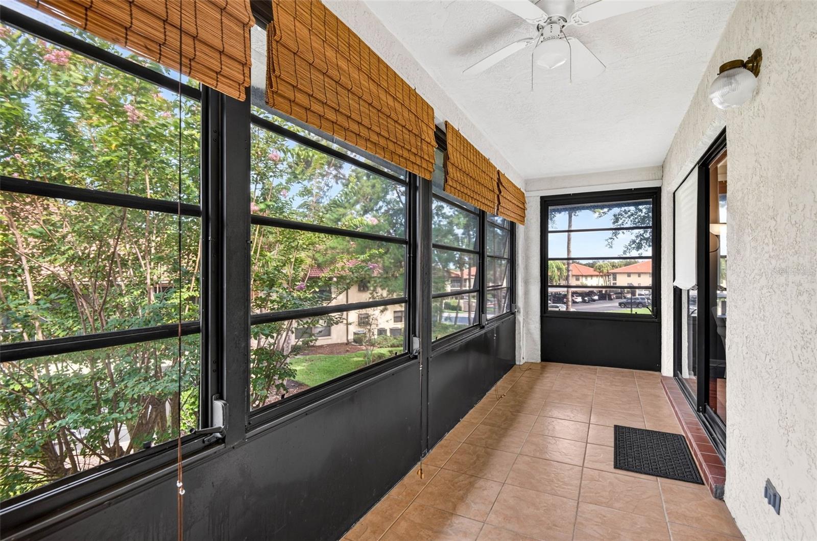 Balcony with sliding glass doors, runs the entire width of the condo.