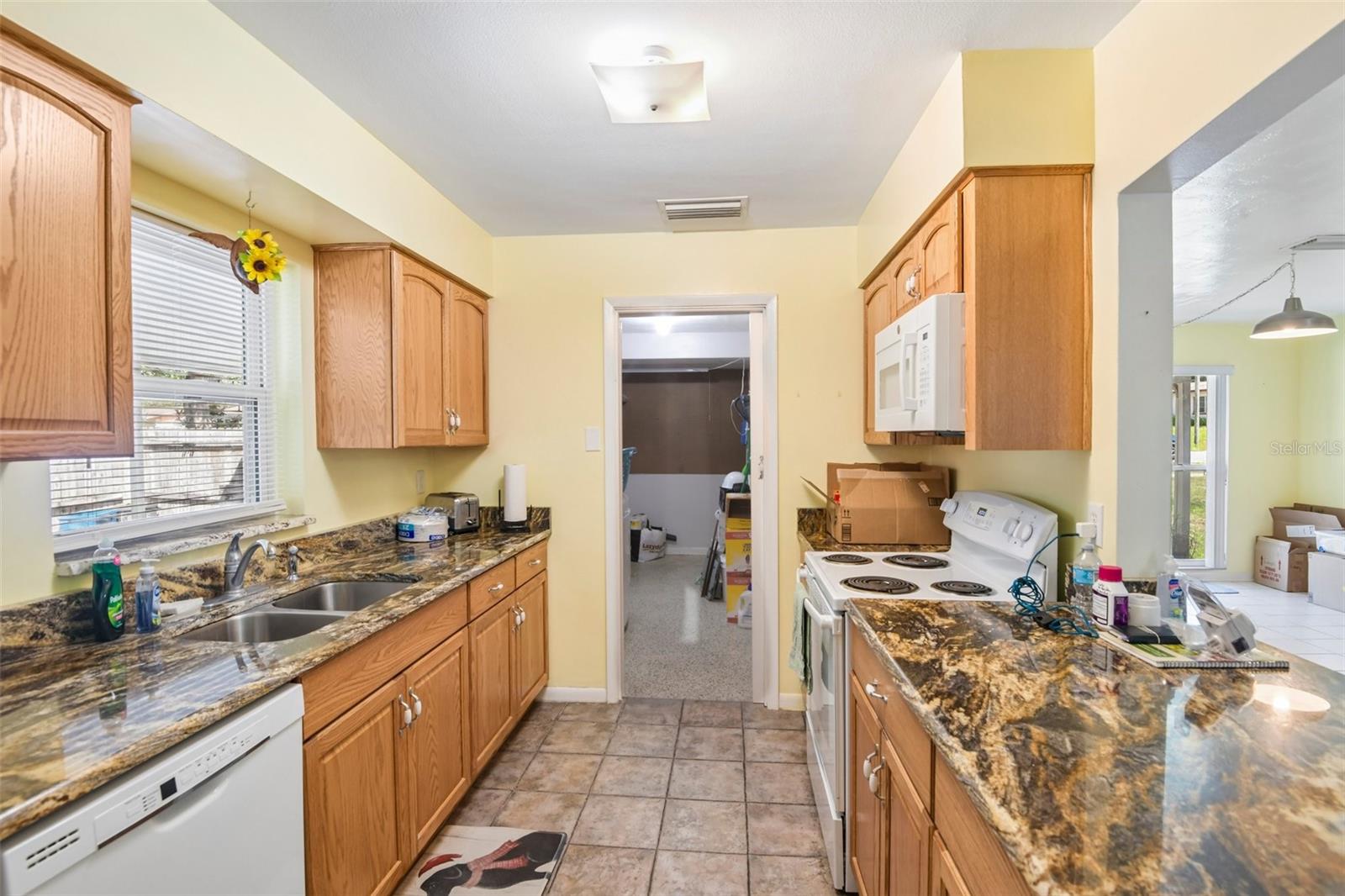 Kitchen looking towards laundry room door open
