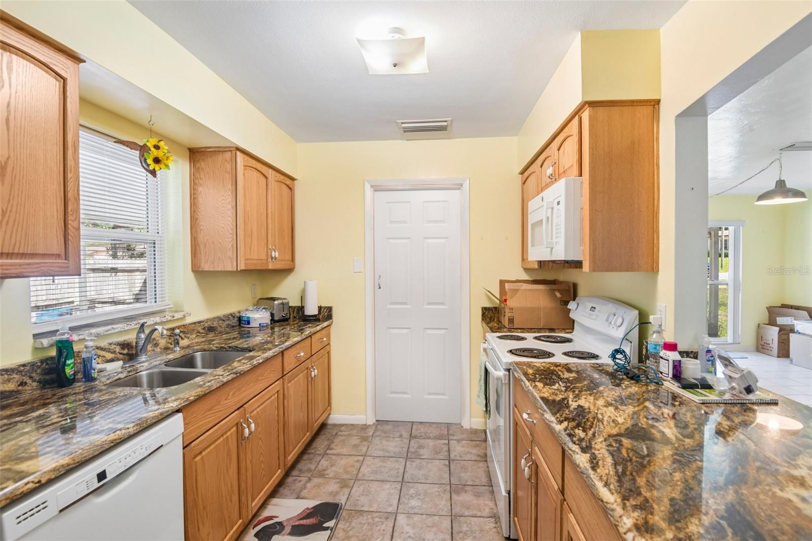 Kitchen looking towards laundry room door closed