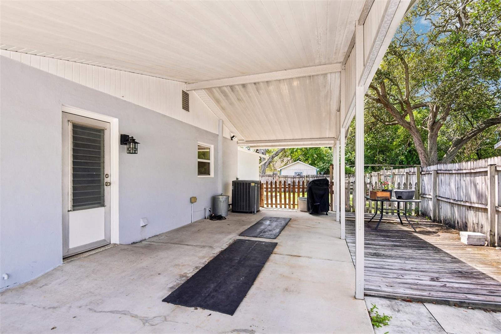 Carport view with deck/patio to right