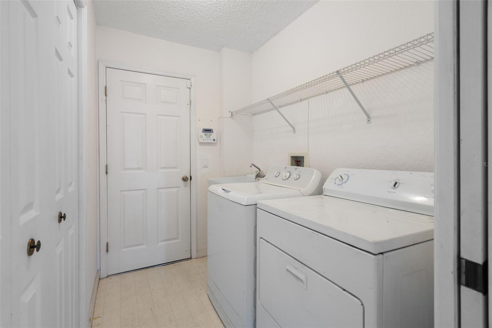 Laundry with storage closet