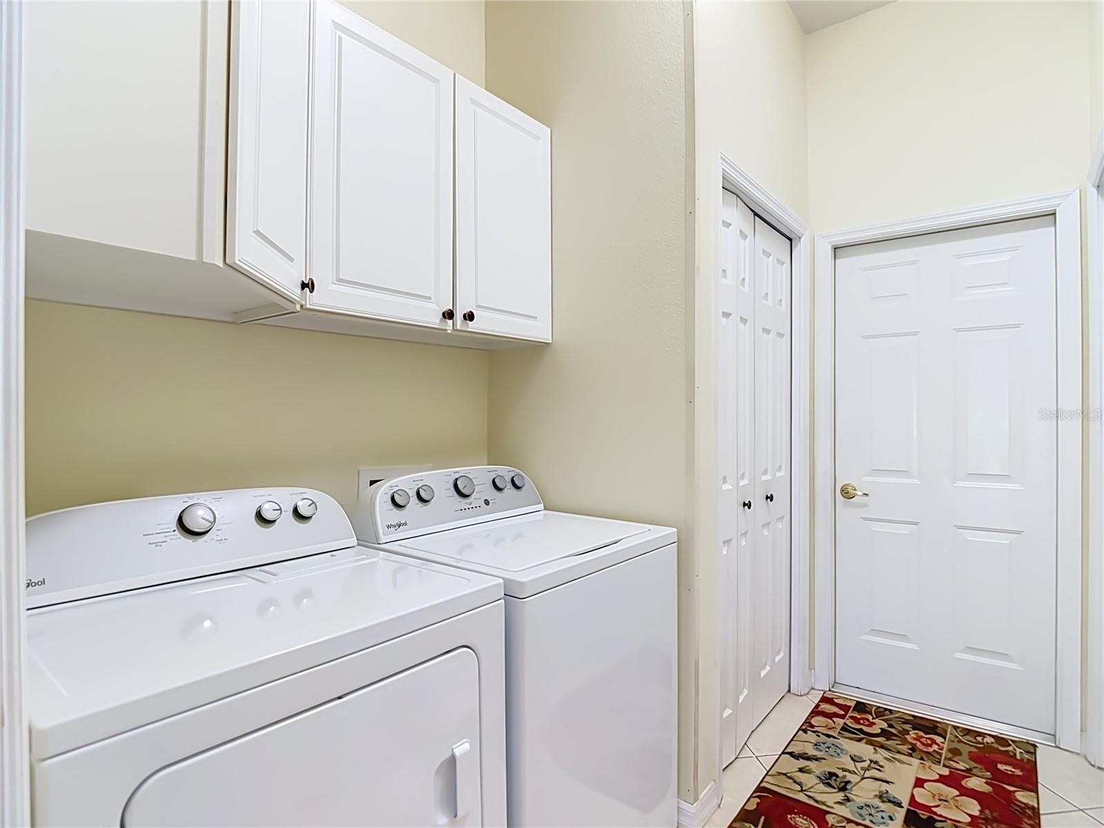Laundry room has three built in closets for storage.