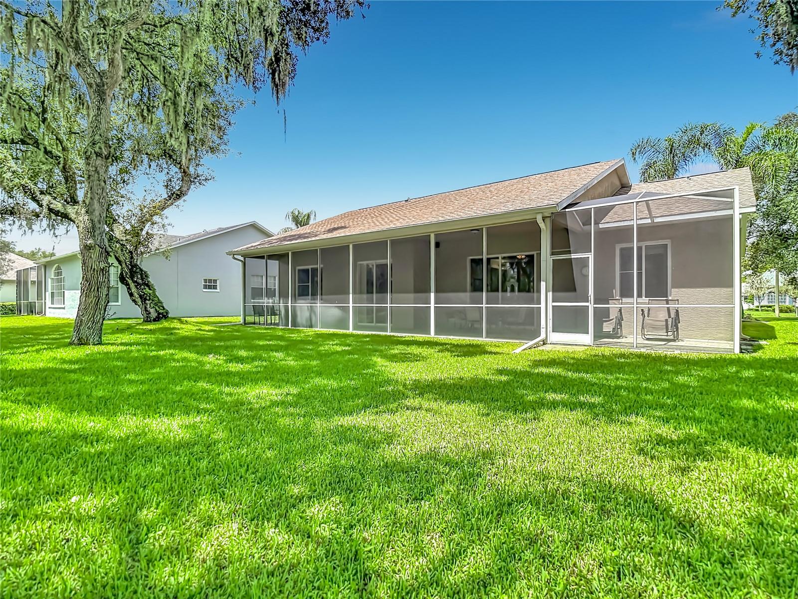 Rear view of lania, and beautiful lawn.  Well water irrigated lawn