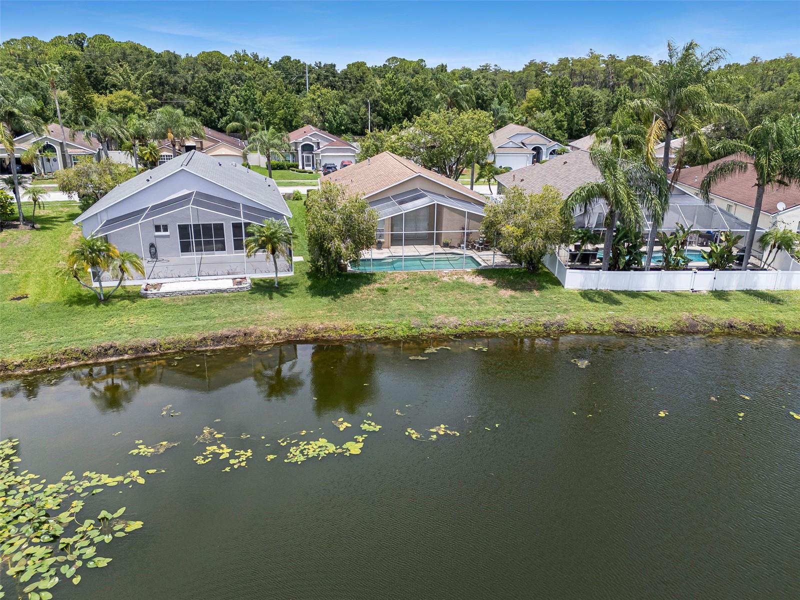 Aerial Rearview of Home From Lake