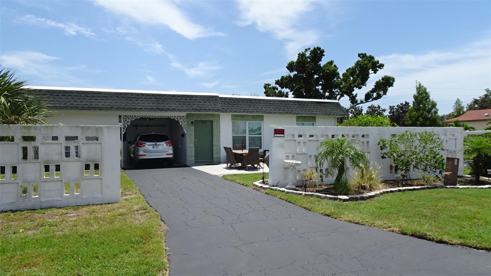 Corner Villa, extra long driveway and large front yard.