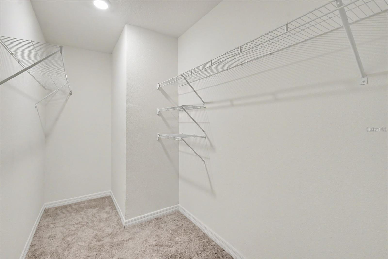Primary walk-in closet.