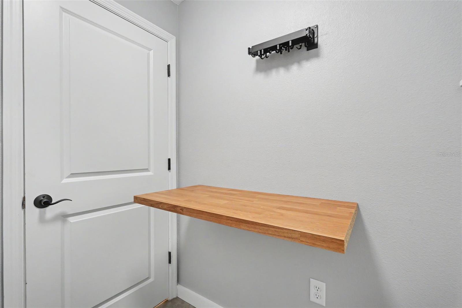 Fold-down laundry station