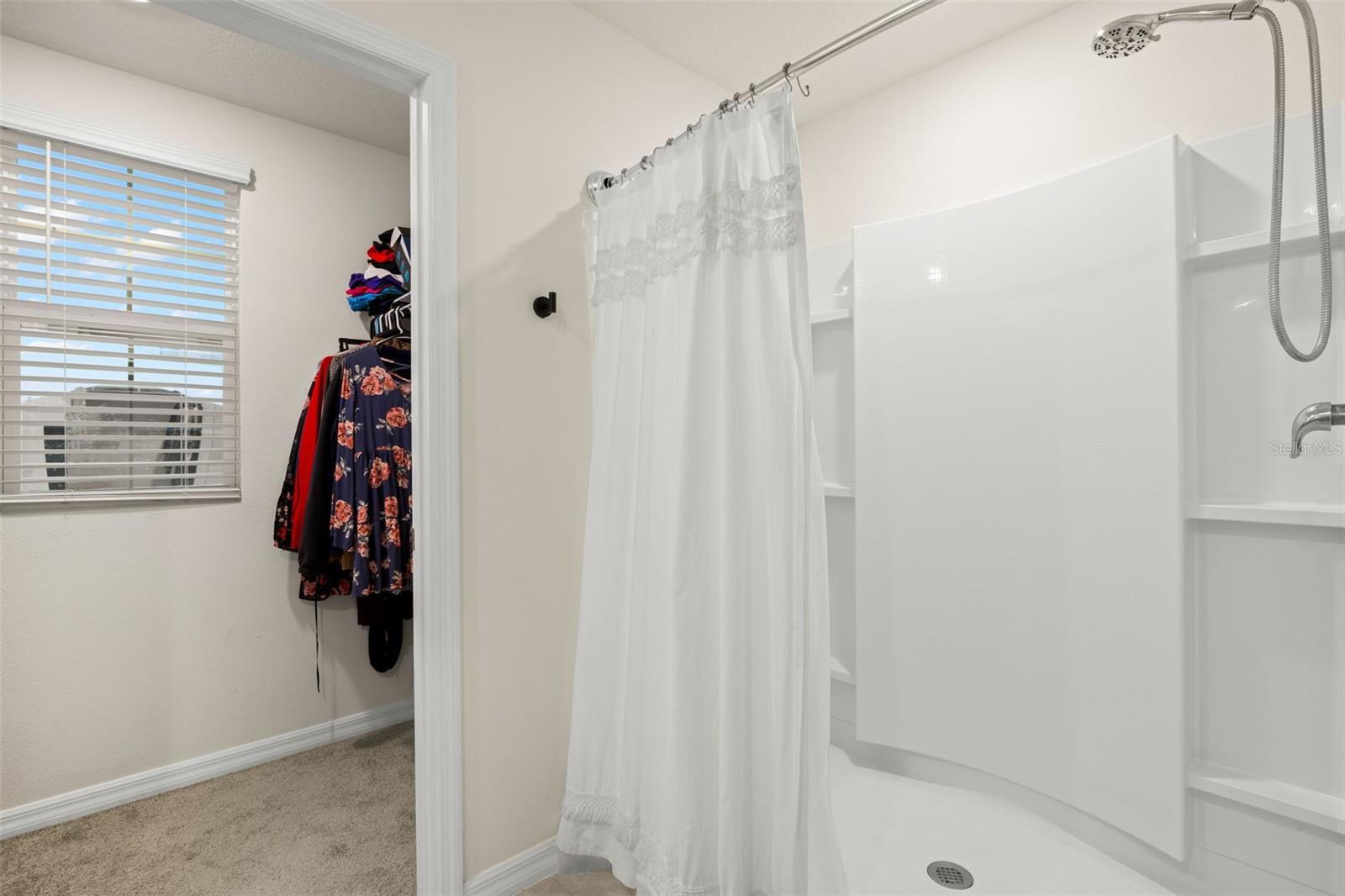 Primary Bathroom - Showing 1 of the 2 Walk-In Closets