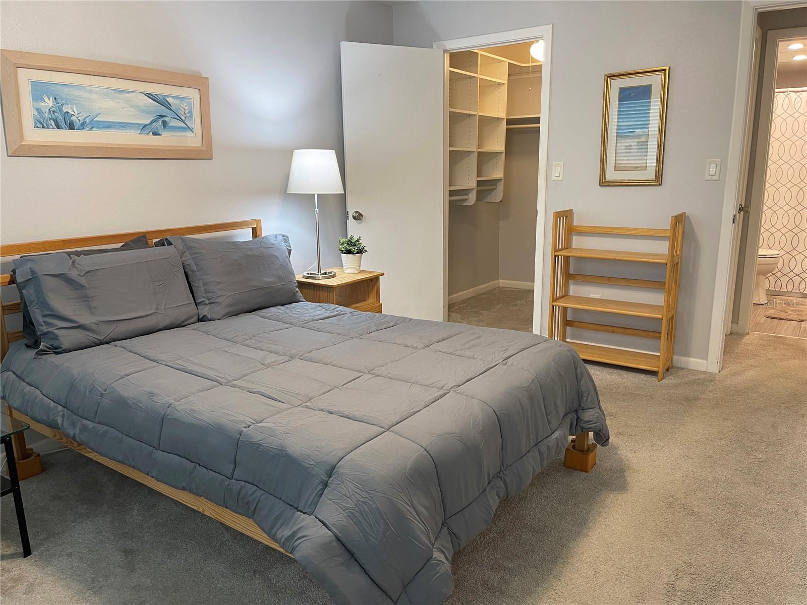 Bedroom features roomy area with large walk-in closet and room for