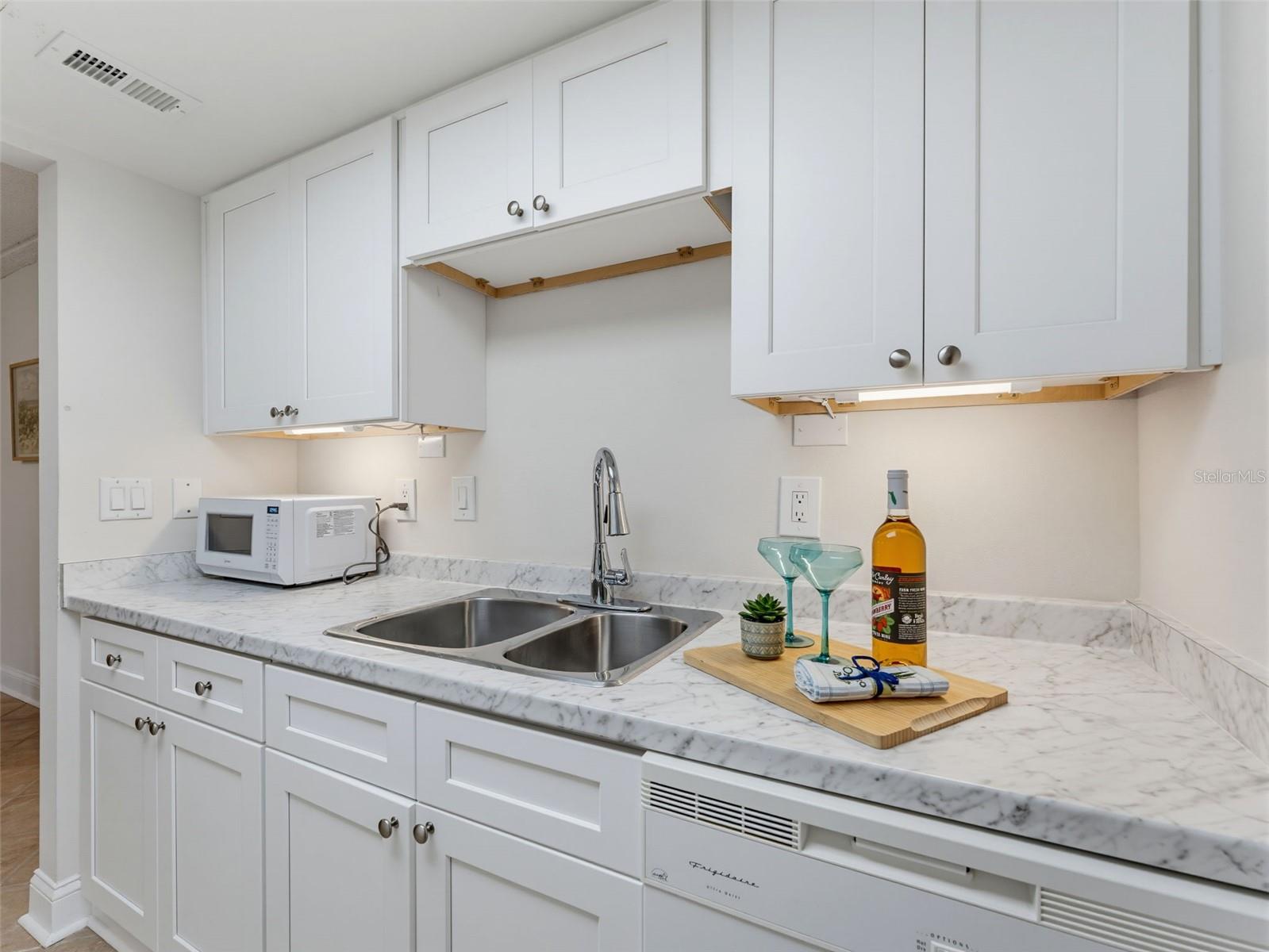 everything in cabinets, including dinner plates, drinkware and more