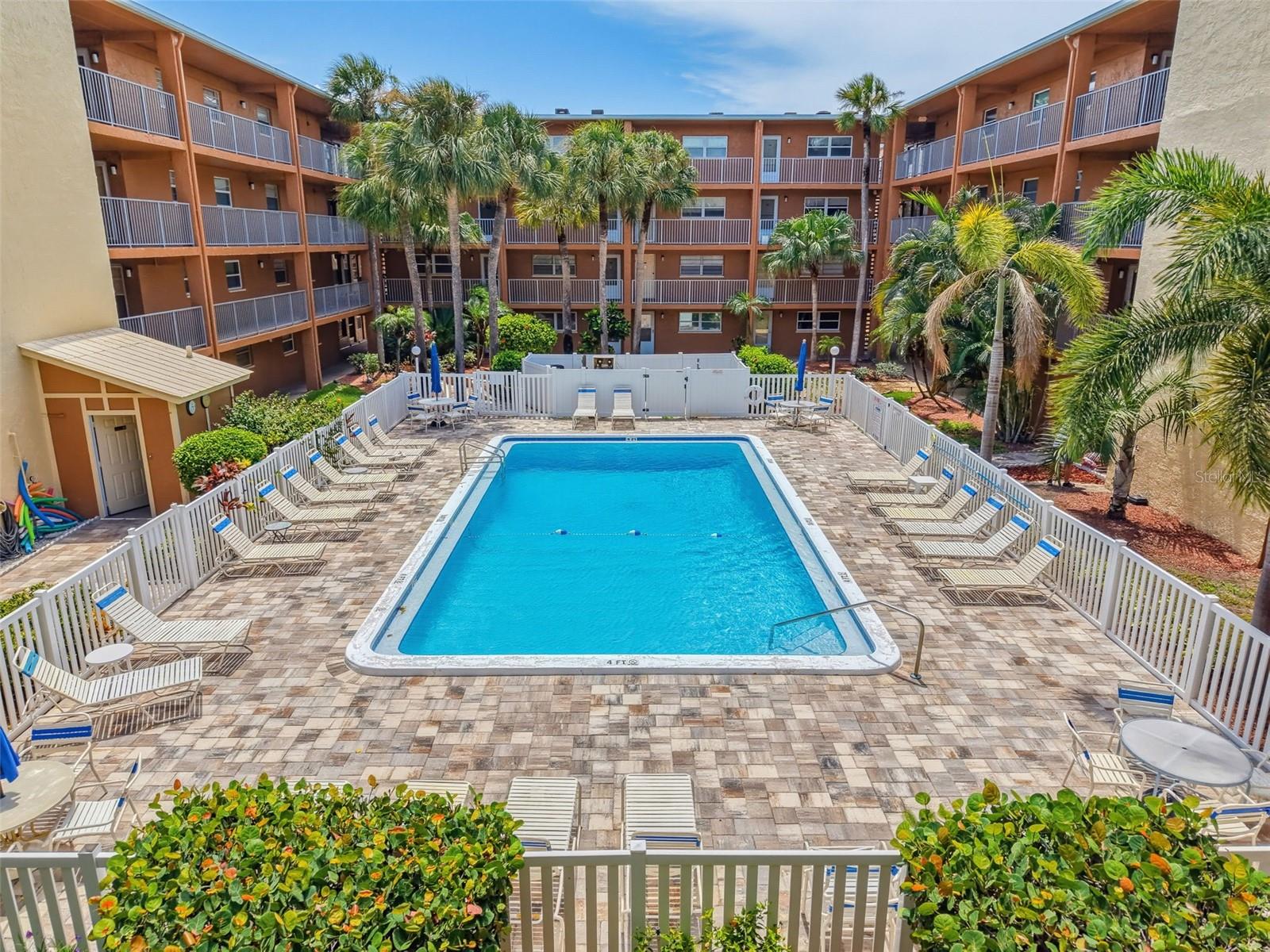 New brick pavers surrounding heated pool of 2