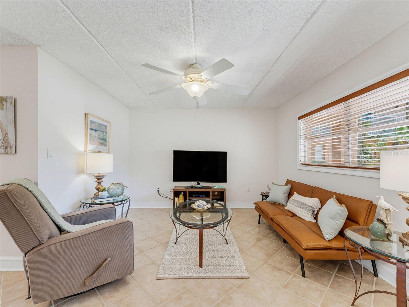 Living room furniture & TV included in sale.