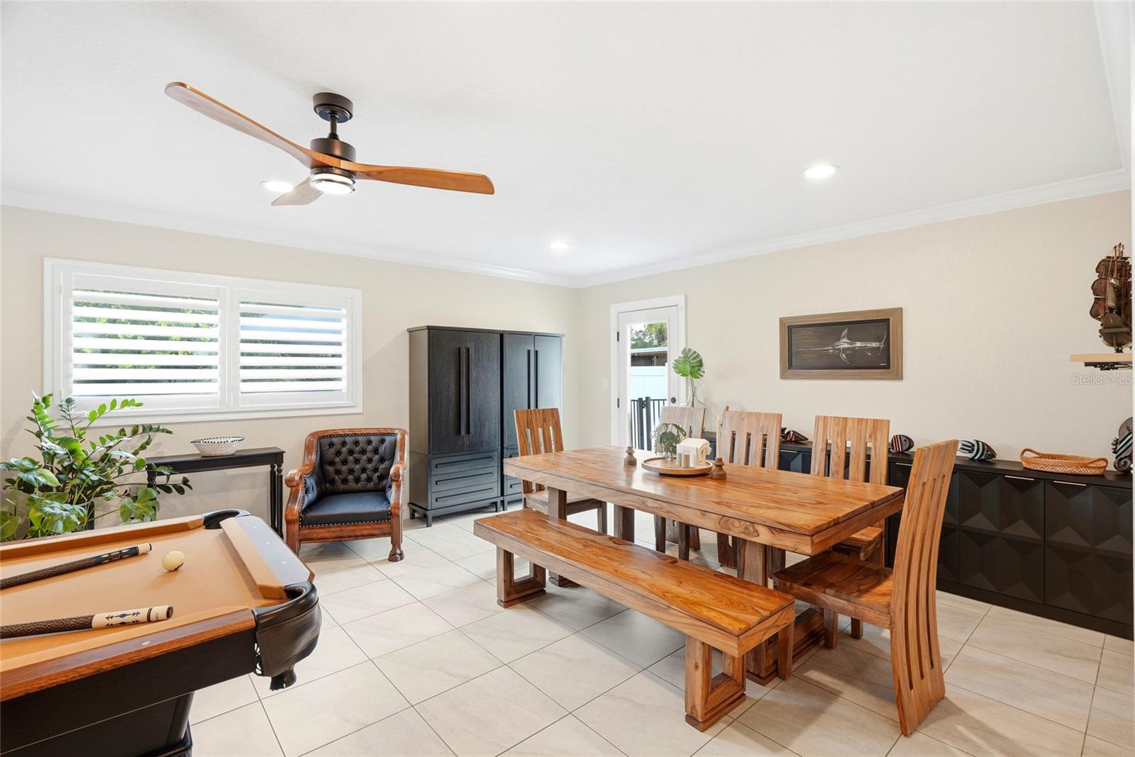 This is a large Family room or multi-purpose room (currently being used as a Dining Room and Game Room