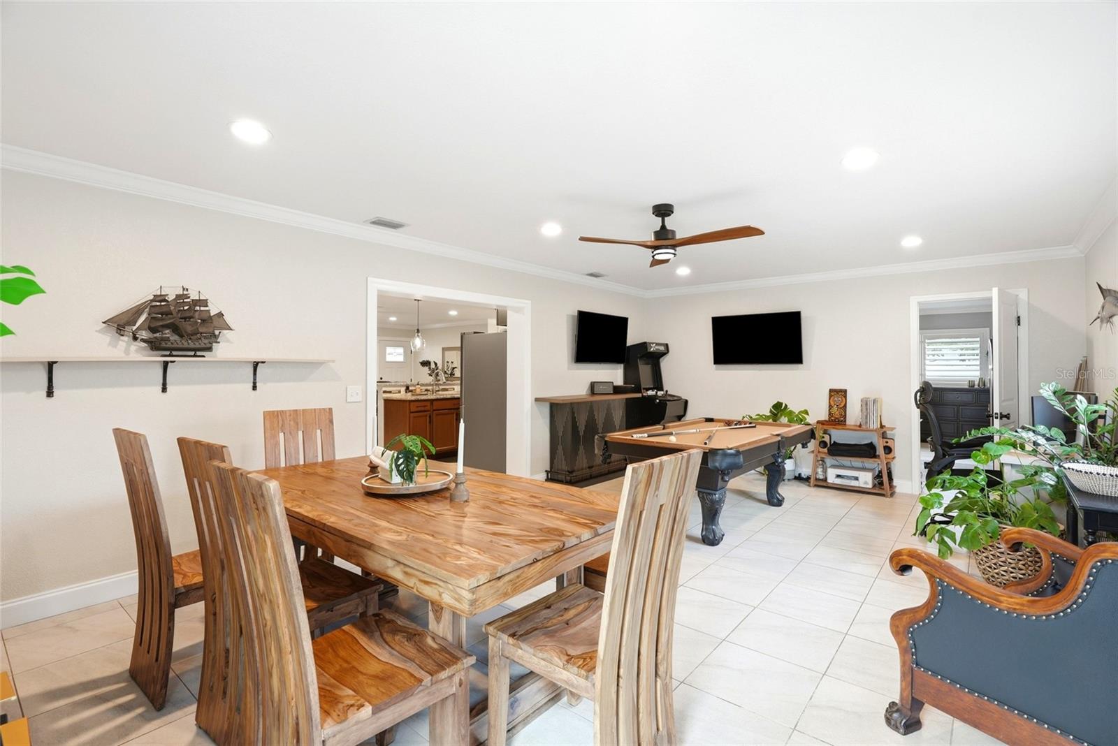 This is a large Family room or multi-purpose room (currently being used as a Dining Room and Game Room