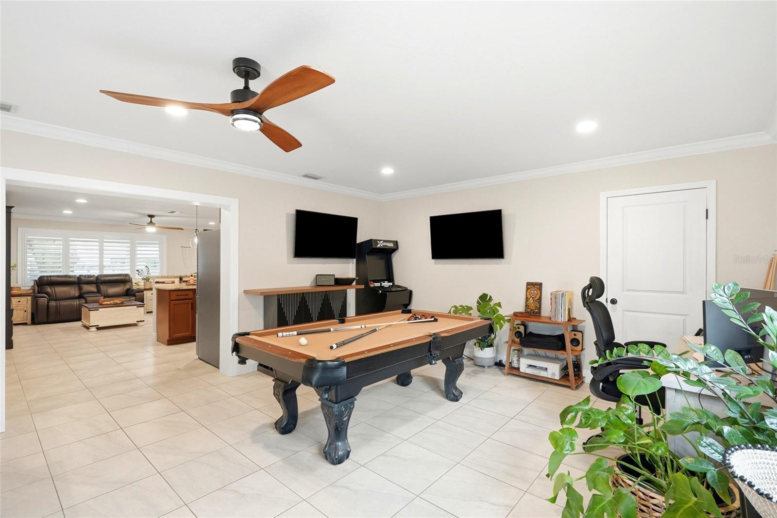This is a large Family room or multi-purpose room (currently being used as a Dining Room and Game Room