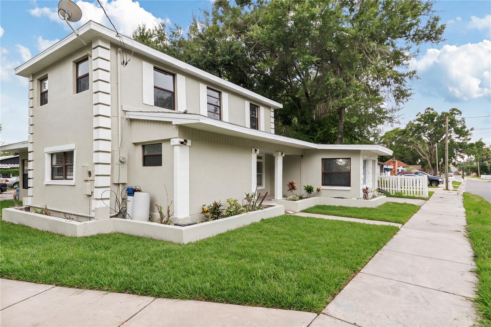 Corner lot with large back yard and driveway