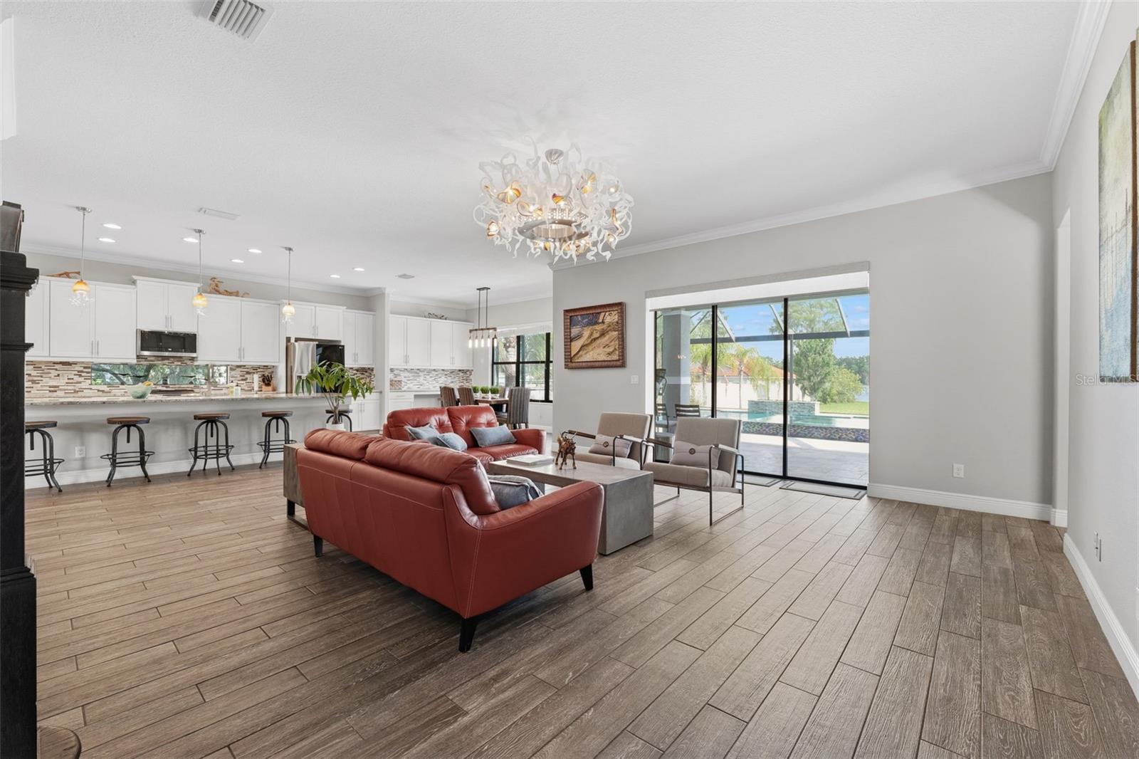 Expansive Living Area with Stunning Lake & Pool Views