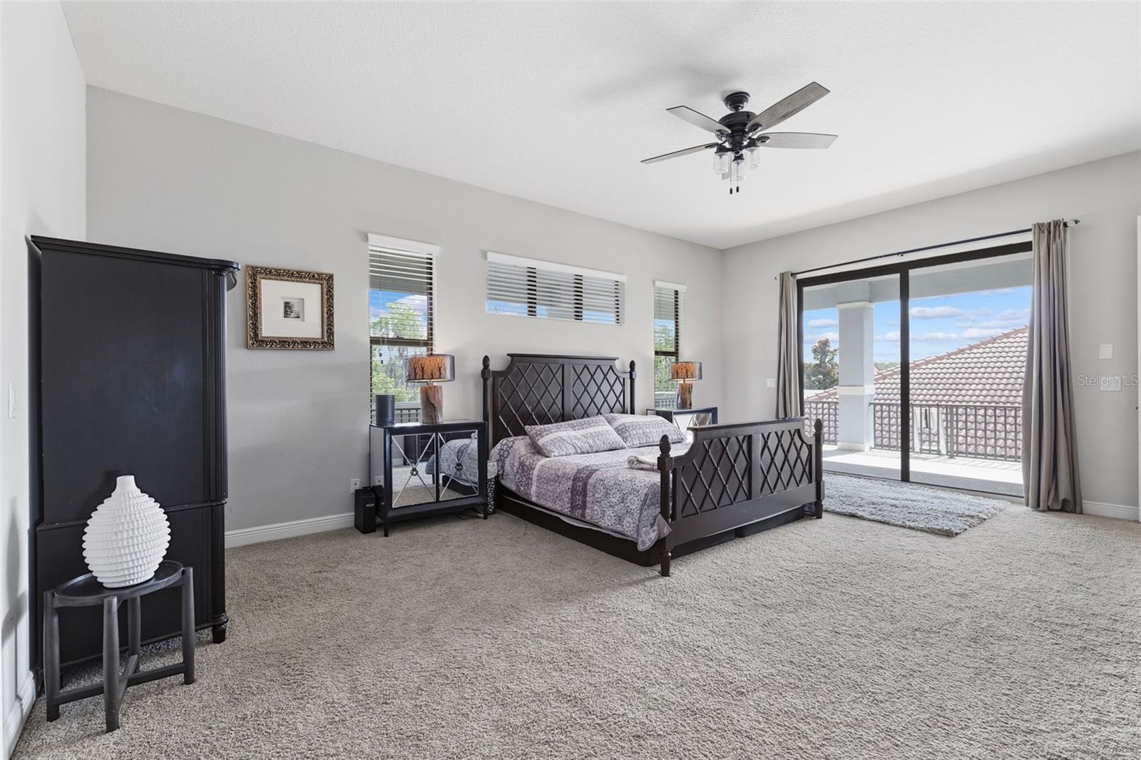Primary Suite Retreat with Private Balcony Overlooking the Water