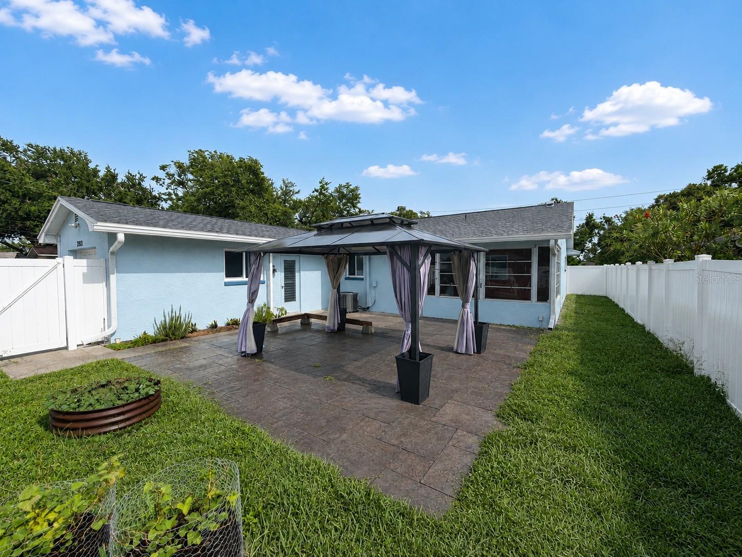 Enjoy Florida living in the fenced in yard.  Plenty of room for a pool.