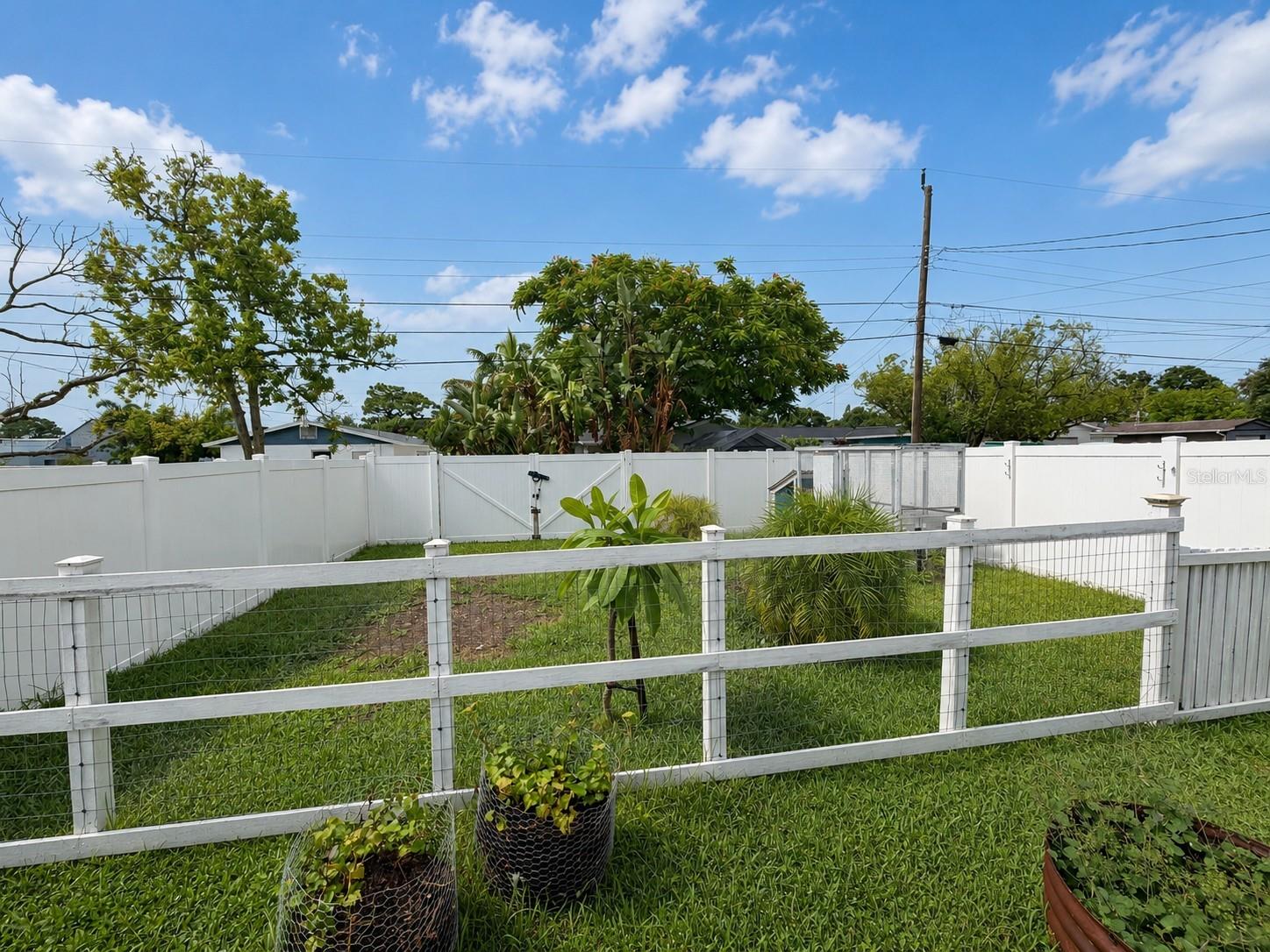 Enjoy the privacy in your large, fenced, back yard with alley access.