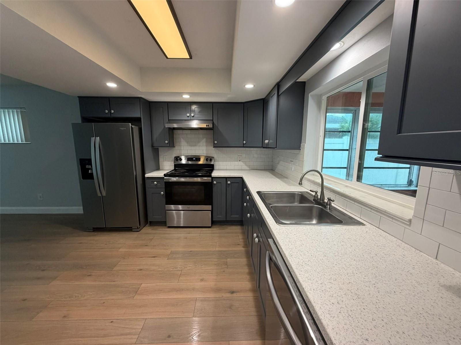 Filled with natural light & enhanced by recessed lighting, the kitchen offers an open, inviting flow into the spacious bonus room.