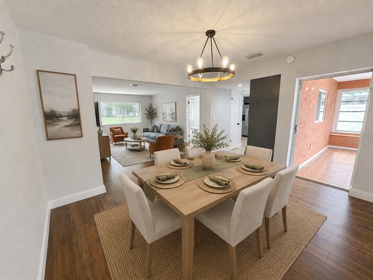 The expansive dining room serves as the heart of the home, offering a seamless connection to the kitchen, living room & Florida room for effortless entertaining & comfortable everyday living.  These rooms have been virtually staged.