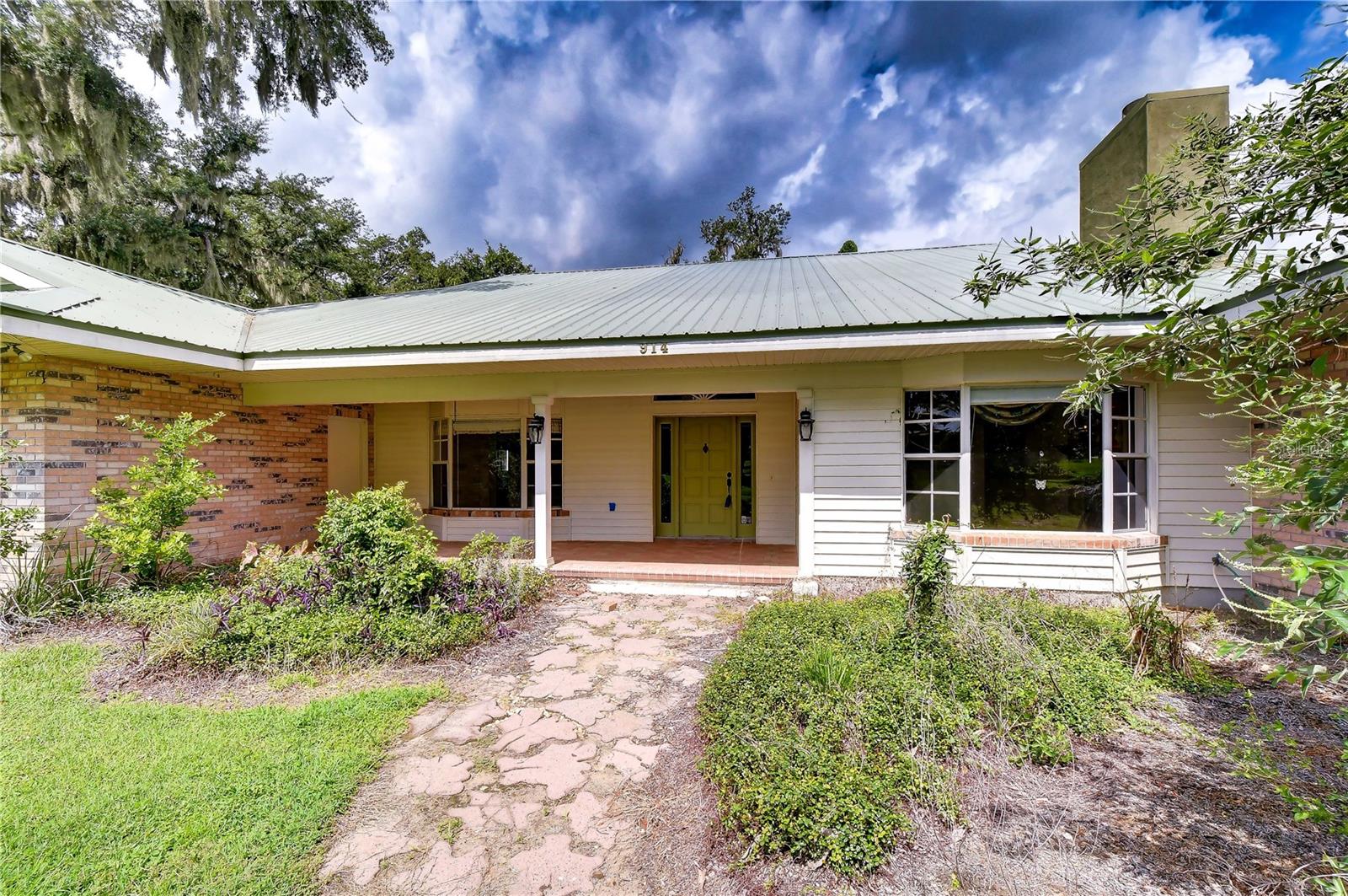 Timeless custom architecture with inviting curb appeal.