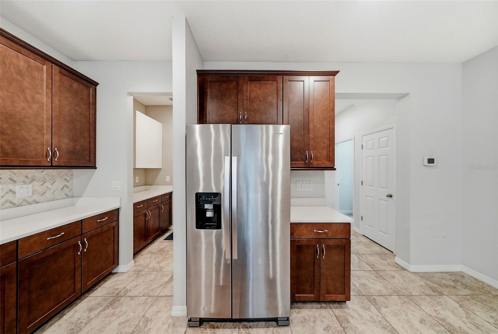 View into the laundry room and pantry area